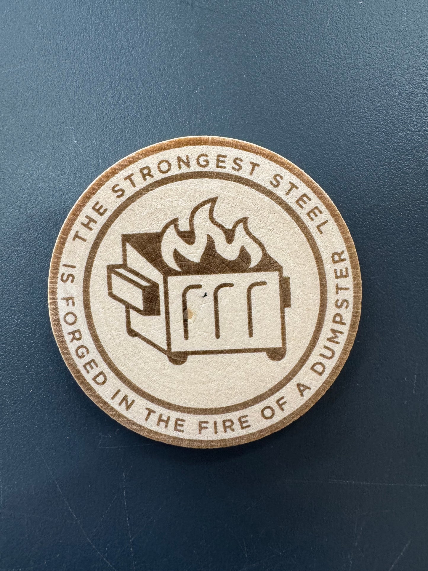 Dumpster fire wood medallion